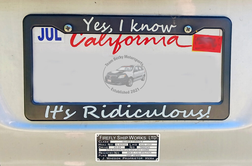 One of the two Firefly stickers, resting beneath Becky's declamatory license plate frame.