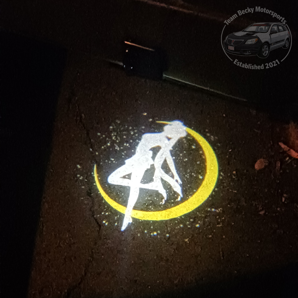 For a time, Becky sported a Sailor Moon projector on each front door, illuminating the ground with a Sailor Moon silhouette