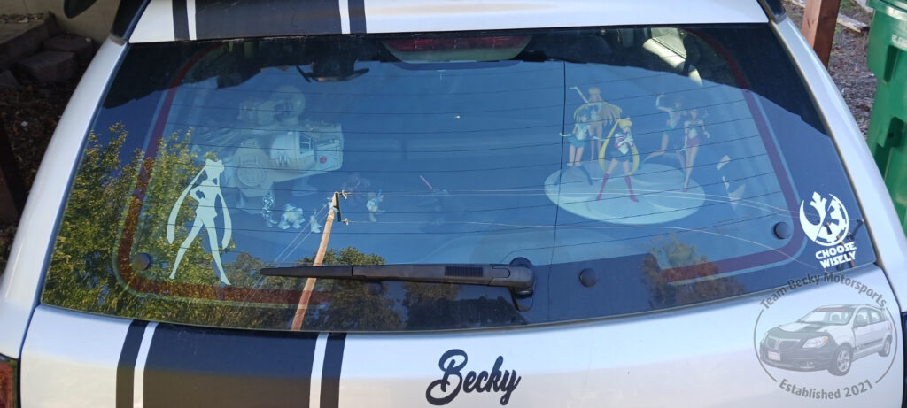 The view into Becky's rear window: A Star Wars Galactic Heroes diorama, with the Falcon, and a collection of Sailor Scouts